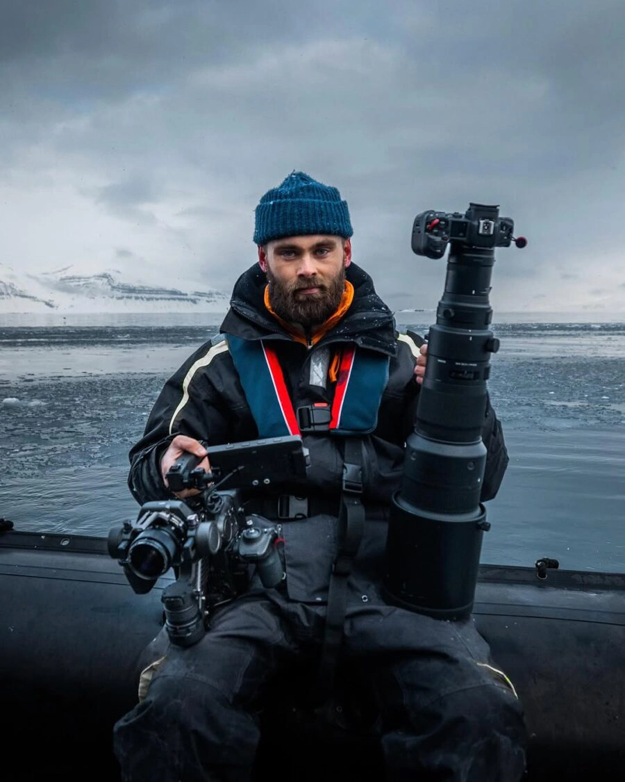 Benjamin Hardman photographing an icy Arctic landscape
